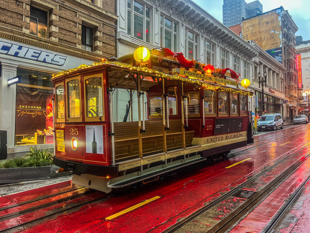 The @sfmta_muni @sf_cablecar decked out for #CNY was looking a little soggy on Sun 2/4 but looks very sharp  #sfmuni #cablecars #sanfrancisco <a href="/sfmsr/">Market Street Railway</a> <a href="/munidiaries/">Muni Diaries</a> @sfccm
