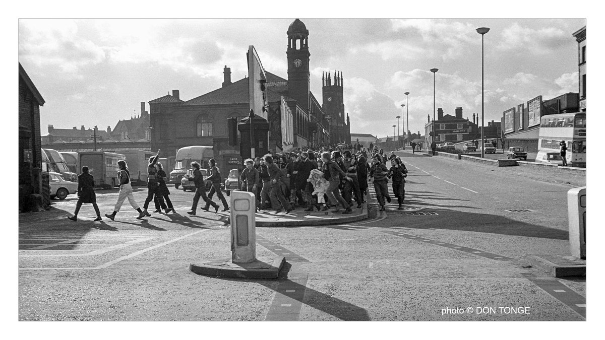 Luton fans on their way to Burnden Park, Bolton, Lancashire, England UK a few decades ago.

#britishculturearchive #caferoyalbooks etsy.com/uk/shop/DonTon… 
#blackandwhitephotography #monochrome #filmphotography #britishphotography  #socialhistory #documentingbritain