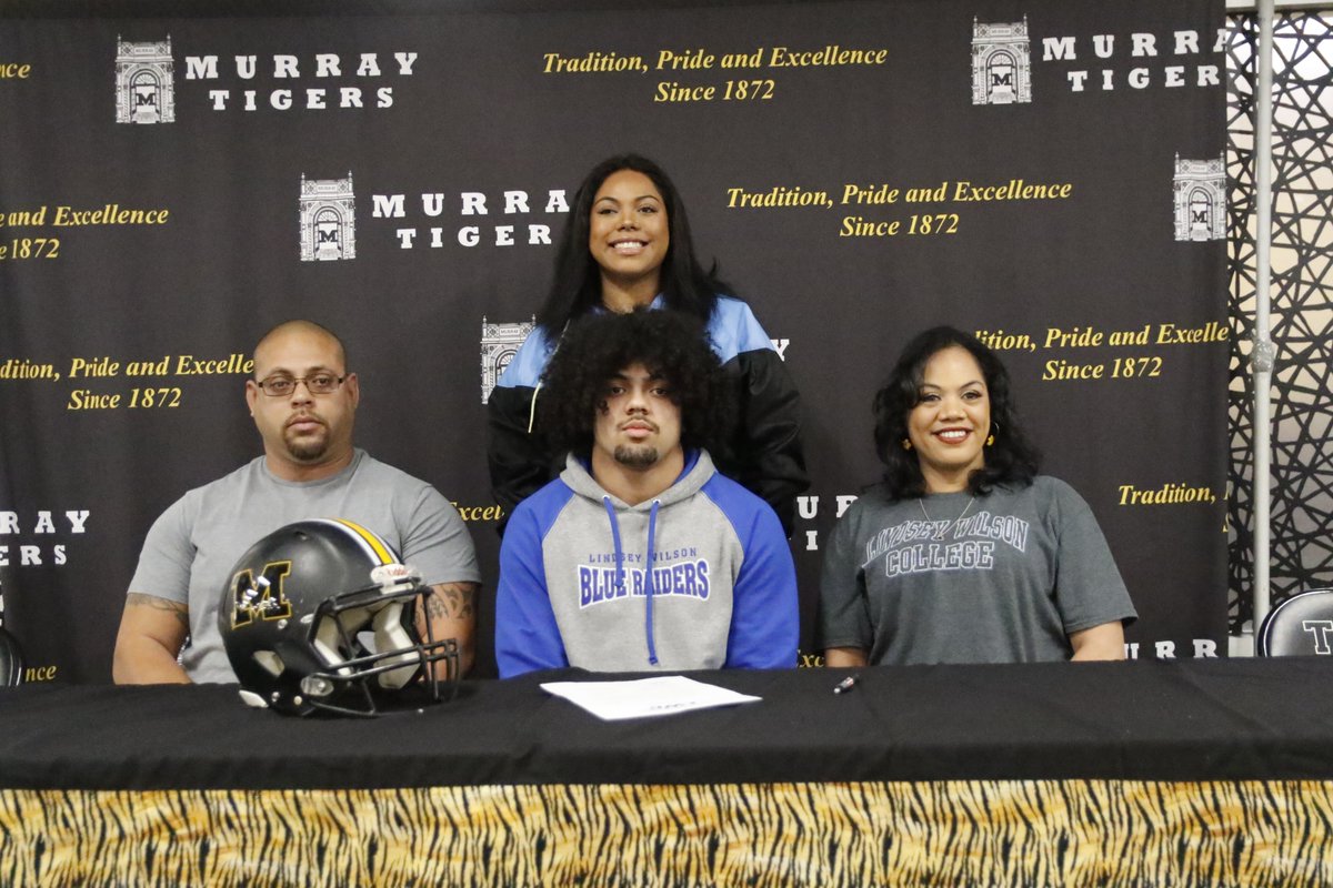 >@kainoa1322 signs with @LWCAthletics Football with his family at Murray High School Monday afternoon.