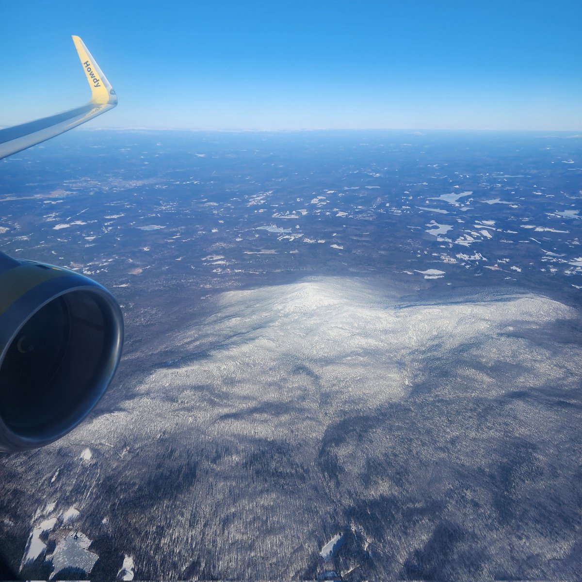 I know it's not #wingletwednesday, but had to share the photo I took of Gap Mountain, NH this morning while descending into @flymanchester on @SpiritAirlines. A bright yellow plane soaring through a bluebird blue sky over a snow crested mountain! I love flying! @VisitNH