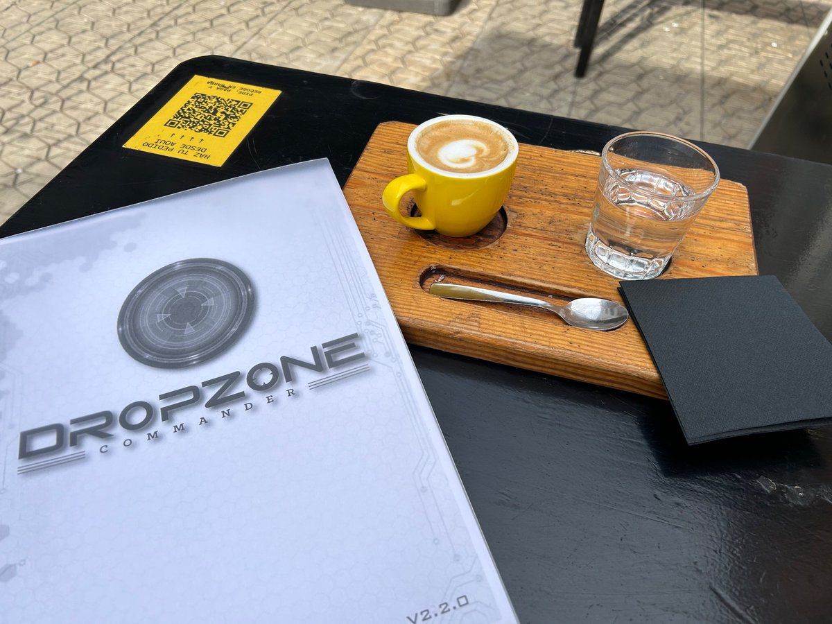 Hastur's tweet image. Two of my passions: coffee and miniature games, this time with @TTCombat’s awesome #DropzoneCommander.