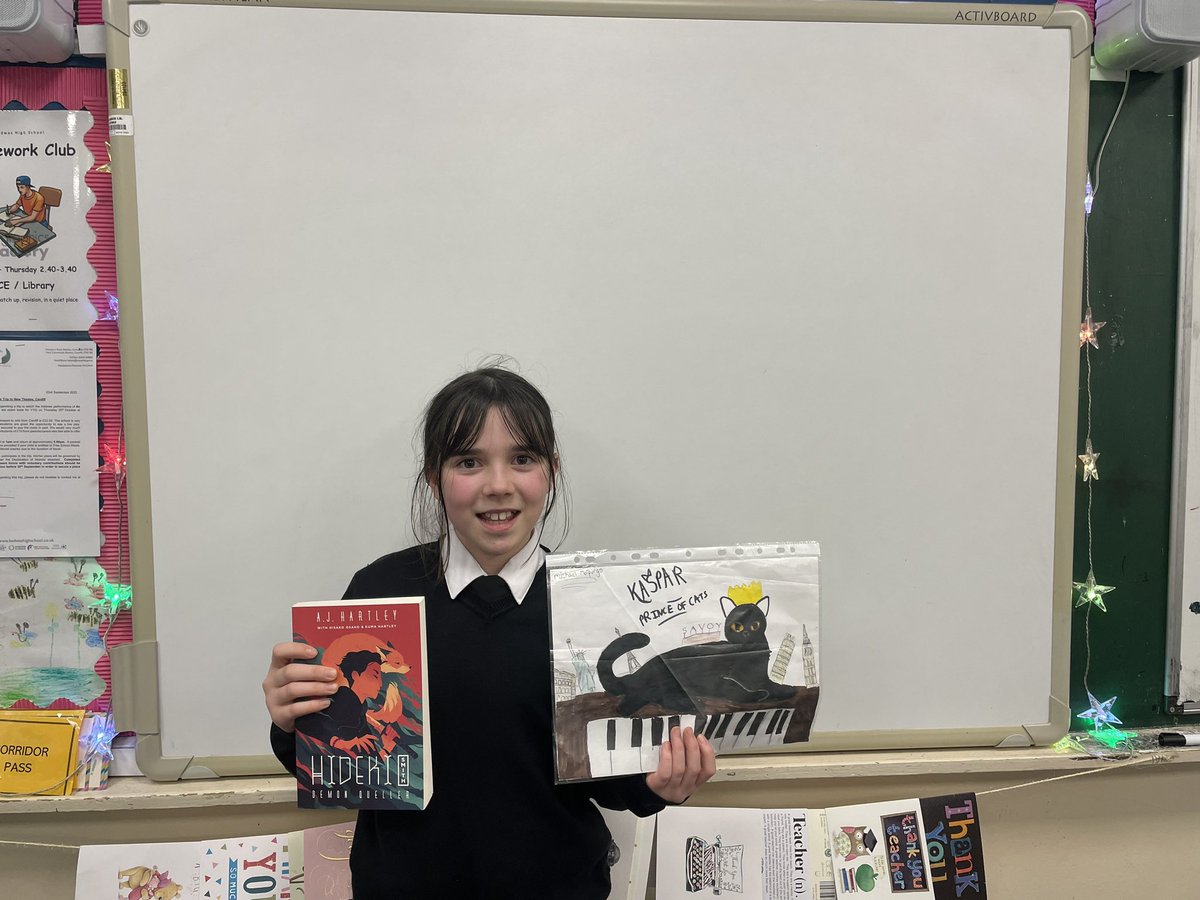 BedwasEnglish's tweet photo. Well done to Kitty Jones from 7E, who is the first entrant for our World Book Day book cover competition. Here she is with her design and the book she chose as a prize courtesy of @the_tidy 📕 @BedwasLiteracy @bedwashighsch https://t.co/wm4LbgkQbk