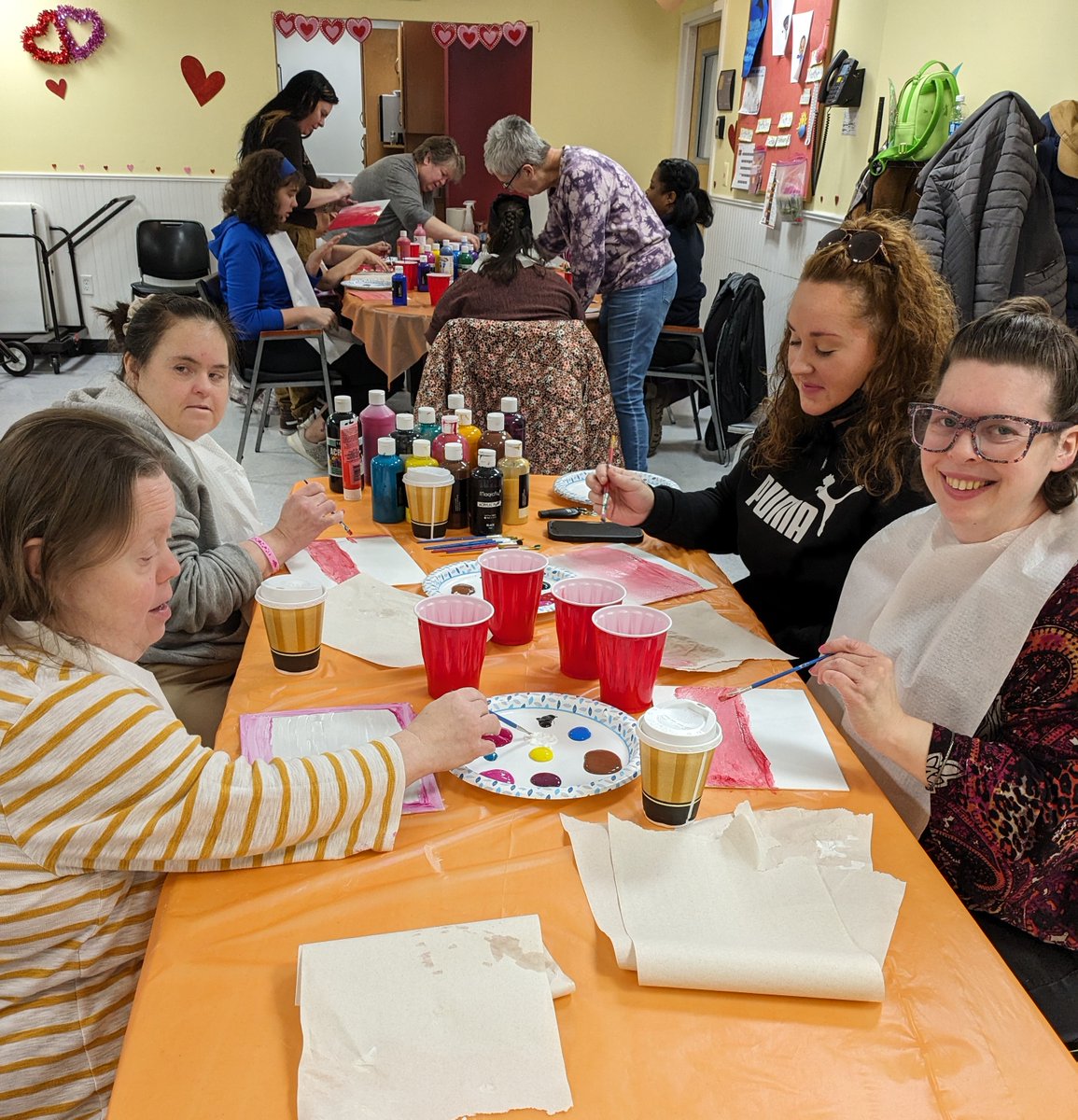 TheArcECT's tweet photo. Clubhouse Day program artists learned canvas priming techniques and created paintings for Valentine's Day today. Thanks to this group, all our offices are decorated beautifully! #valentinesday2024 https://t.co/yQioC8QLIp