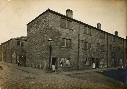 Thrift Street, Bramley, Leeds with  stone built terraced houses. The industrial looking three storey accomodation was  demolished prior to the 1970s. The street's  1891 census records at  genuki.org.uk/big/eng/YKS/WR…  make an interesting read. Image Leeds Museums and Galleries