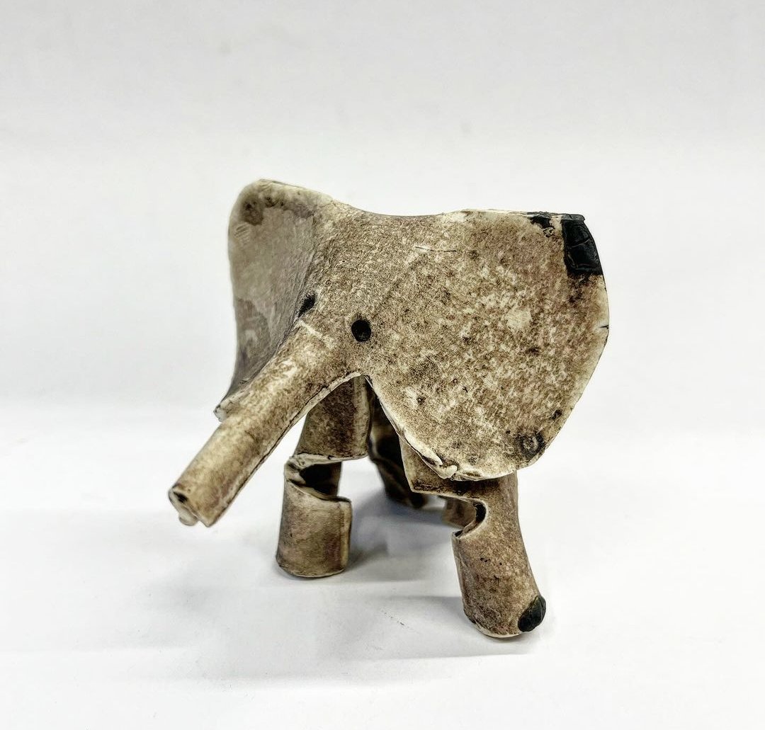 🐘Help! This little elephant has been in our collection a long time. We've no idea who made it and Ken couldn't remember❓ It always gets noticed & admired😊 Made like origami - porcelain rolled out, cut & folded, simple manganese wash. Any ideas? Please let us know in replies