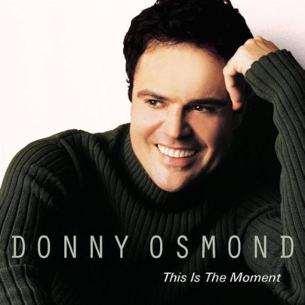donnyosmond's tweet photo. This Is The Moment was released 23 years ago today. Always fun to look back on past releases. Do you have a favorite track off this album? https://t.co/Ut3FSvlT4E