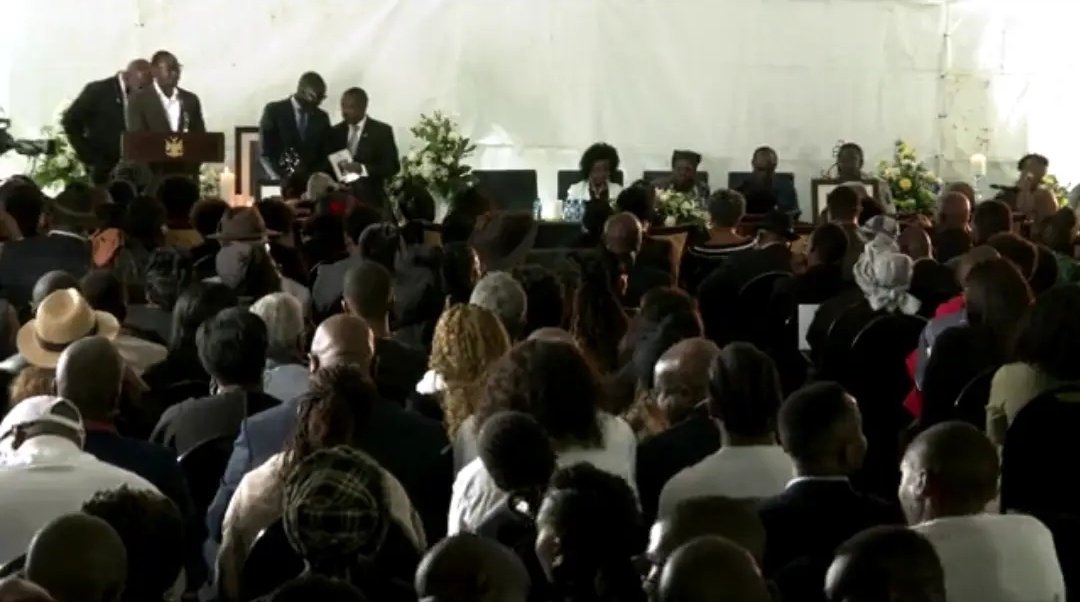 Hon. Neville Andre pays tribute to the late President of Namibia, Dr. Hage Geingob, sharing heartfelt remarks during a solemn moment.