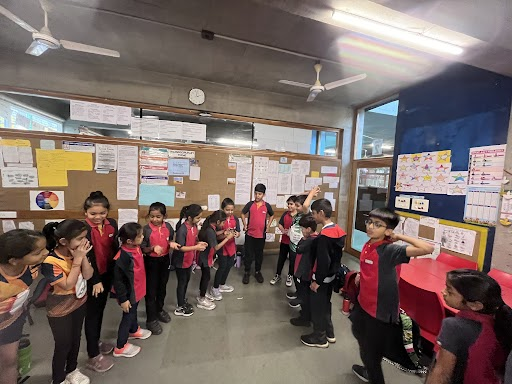 Students have showcased impressive self-management abilities by skillfully focusing their attention and effectively coordinating their hand movements to maintain a delicate equilibrium of water, preventing any spillage.