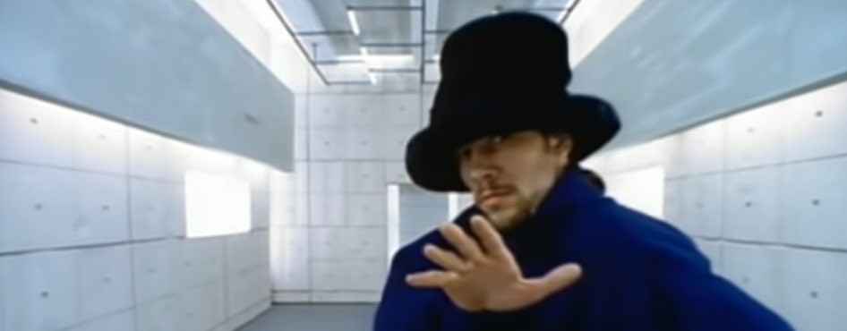 Jamiroquai is walking ahead of you. You rush up to Jamiroquai & knock his big hat off his head. His big hat tumbleweeds down the empty street. From the recesses of Jamiroquai’s big hat, a new world spews forth, a world so full of hidden truths that nothing is not a hidden truth.