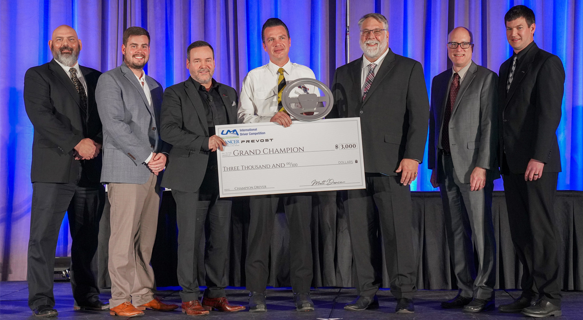 LancerInsurance's tweet photo. Standing ovation for Andy Grecian from Windstar Lines, 2024 #UMA International Driver Competition Grand Champion. We are honored to sponsor this celebration of driving excellence! #LancerInsurance #UMADrives #DriverCompetition #UMAEXPO https://t.co/i8XuENaaWI
