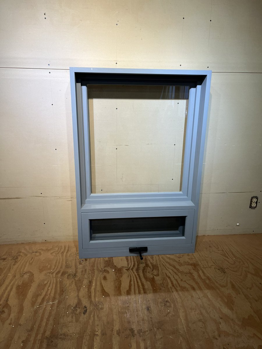 Custom built fixed window with awning operation at the bottom.
