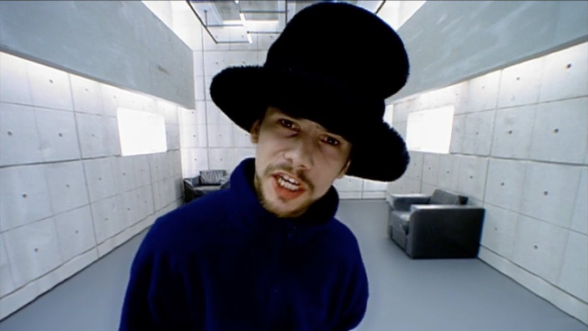 we don't talk enough about how this paranoid freak released virtual insanity in 1996. years before the average person in the uk had even sent a text message, he was dancing like a maniac in his big moving gaff, enraged to the point of song by faxes, teletext and encarta 95.