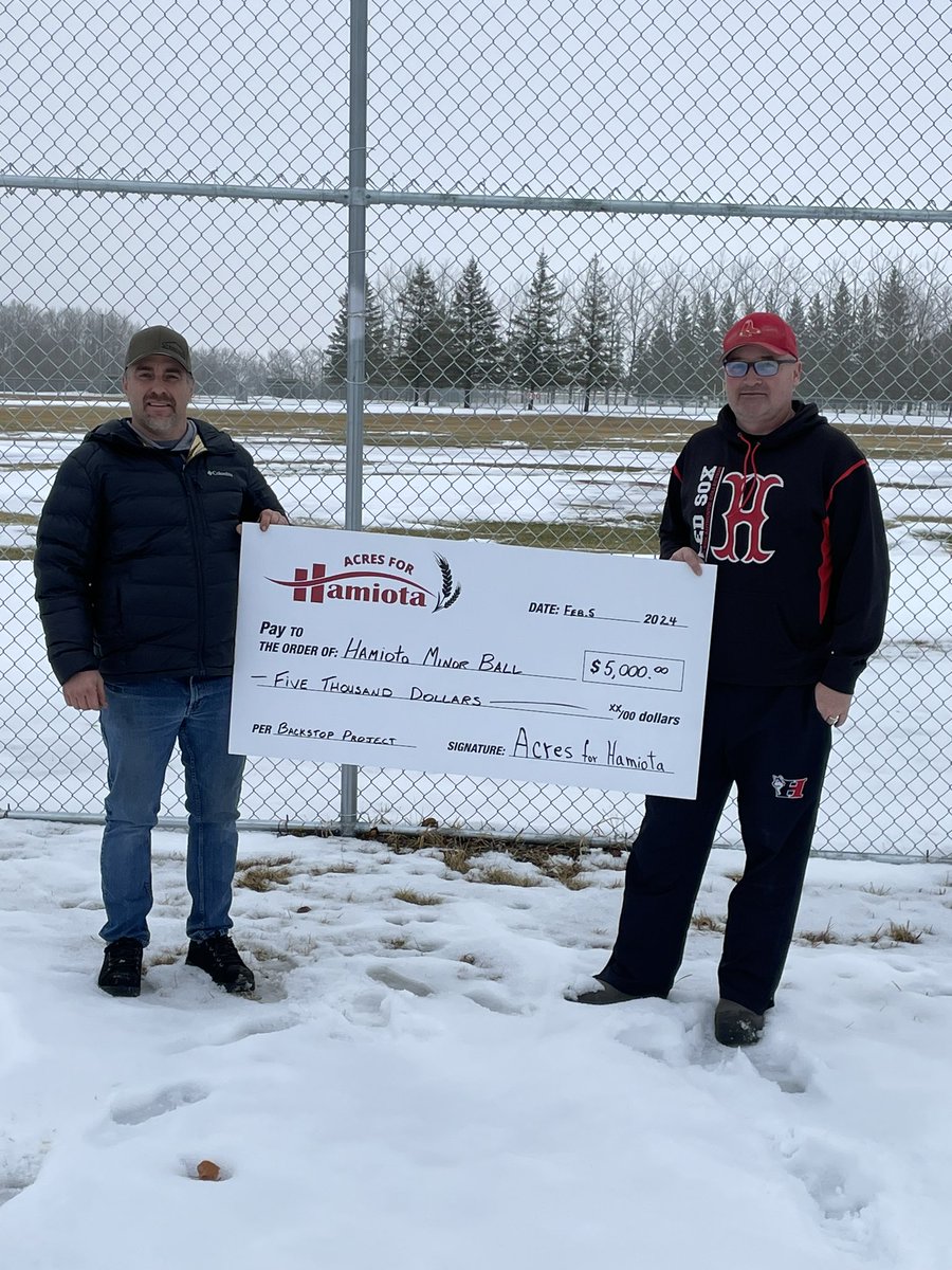 Acres for Hamiota board member Mark Knight presents Hamiota Minor Ball with a cheque to go toward their project of replacing backstops.
