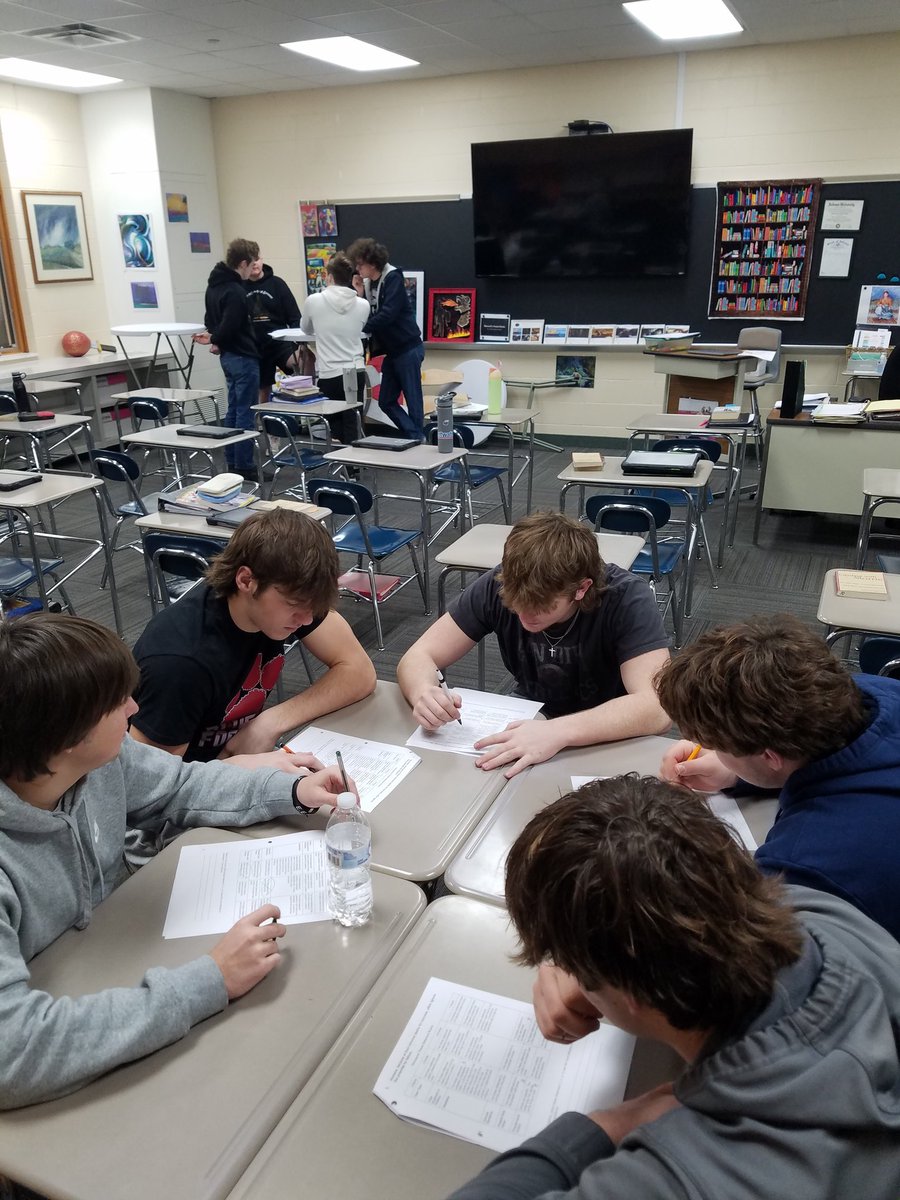 Students in Honors English 12 are discussing the effectiveness of thesis statements. Wow, these students can debate with evidence!