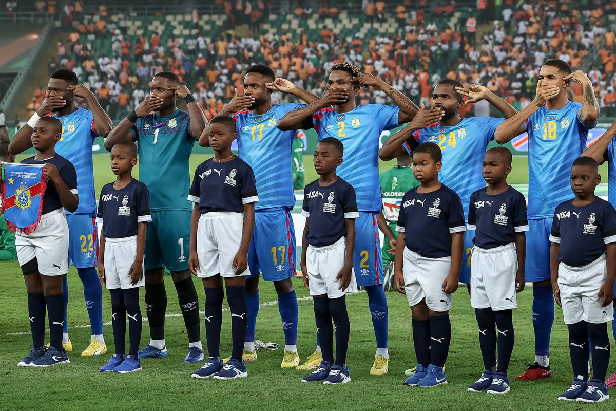 CBSSportsGolazo's tweet image. The DR Congo players &amp;amp; manager gesture during the national anthem ahead of their AFCON semifinal match against Ivory Coast.

Currently there is major conflict in the eastern region of the DR Congo.