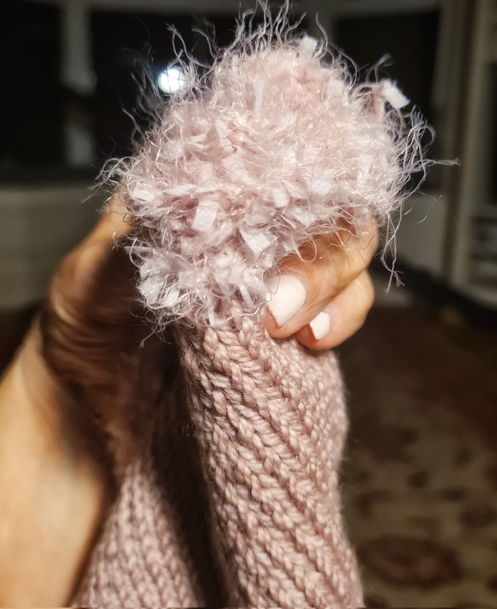 Fabulously frilly hat almost ready to be released and admired.  How good is it when a loitering ball of longheld yarn gets a chance to bloom. #Knitting #knittedhat