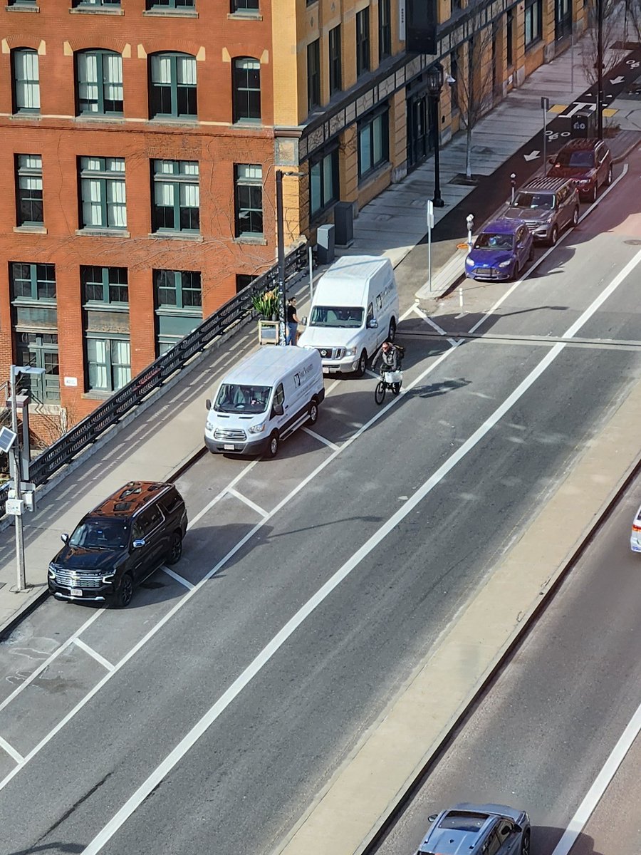 No better picture to illustrate how curb/lane design, not driver attitude, results in unblocked bike lanes.