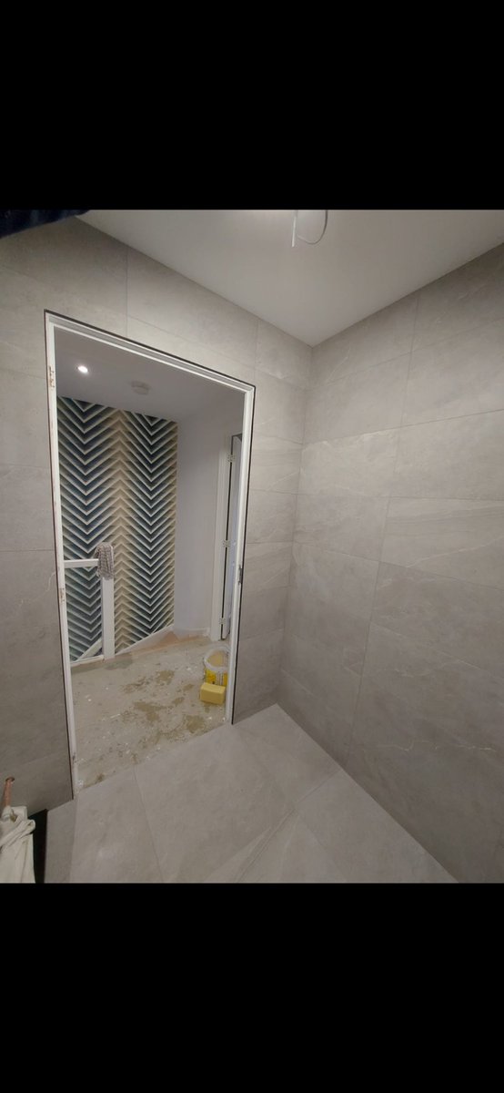 Shower room tiled In gorebridge.
60x30 tiles on the walls.
60x30 feature wall.
60x60 floor tiles.
Tiles finished gunmetal grout 
Externals are a black Matt trim