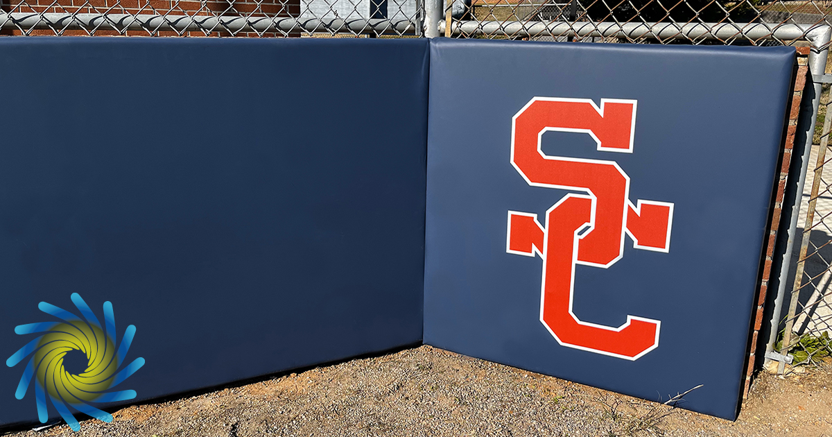 WindscreenFctry's tweet image. Vinyl-covered #backstoppadding with #customlogos enhances #playersafety by providing effective impact absorption during #baseball games. To get durable and customizable backstop padding for your field, call The Windscreen Factory at (888) 619-2228 today.