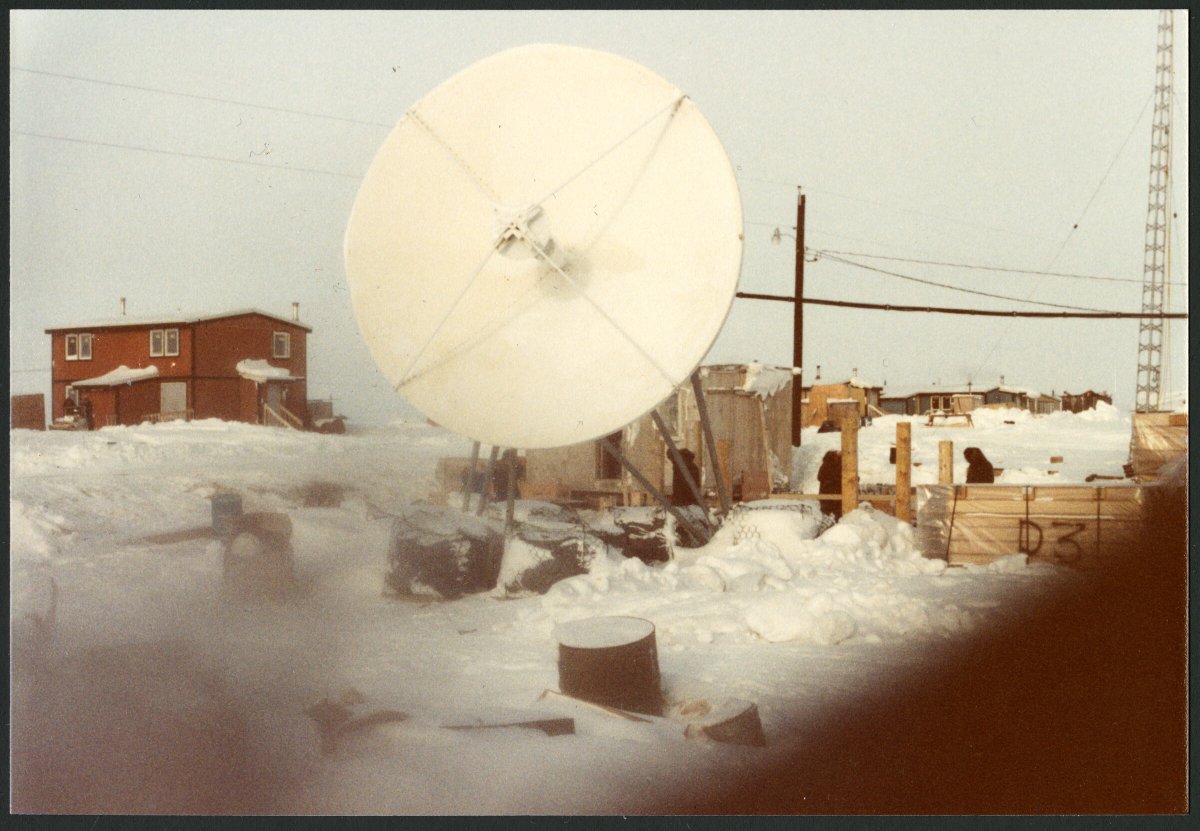 ANC_Historian's tweet photo. January 1982 Nuiqsut. The woman at the desk is Maggie Hobson. Via Anchorage Museum. #alaskahistory #alaska #nuiqsut https://t.co/b6KfsZFOYG