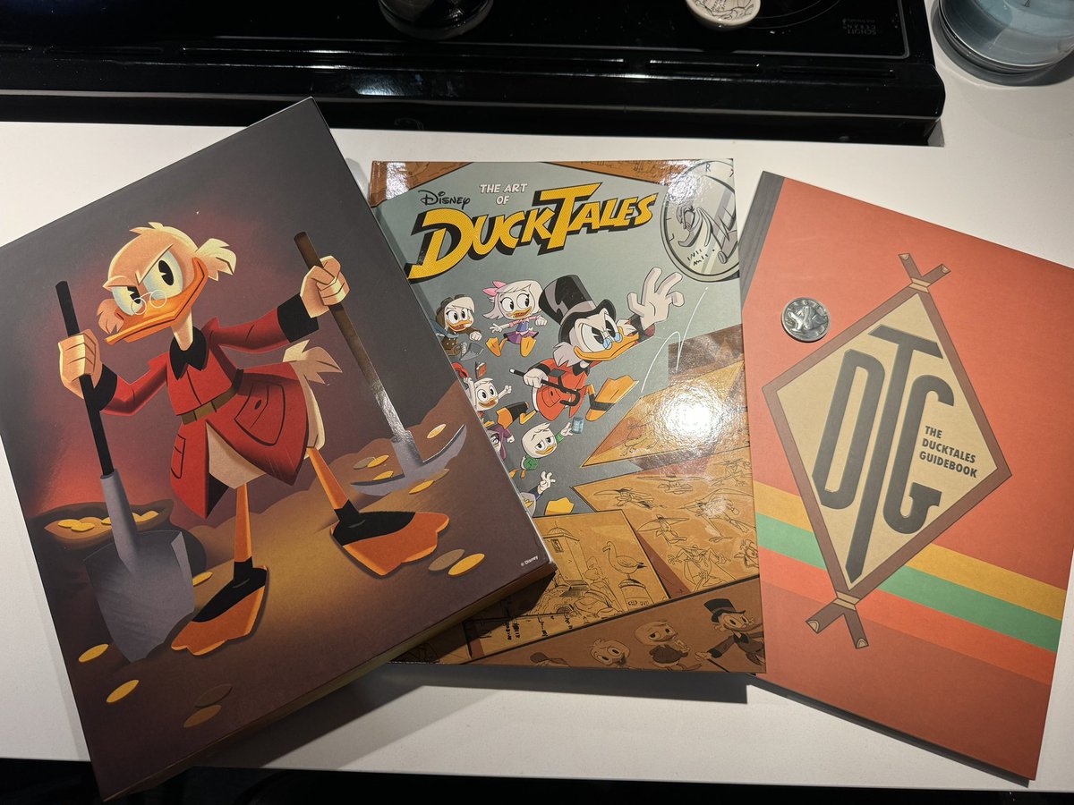 ChadTHX1138's tweet image. My wife gave me the deluxe Art of Ducktales books for my Birthday! Because I worked on it this show. What a fantastic set. It even comes with a metal replica of Uncle Scrooges lucky dime.
