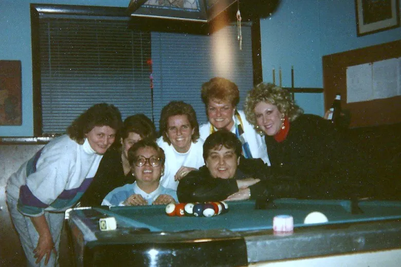 The 1985 Damron gay travel guide lists the Chicago bar Augie's and CK's as popular (*), mostly lesbian (L), and with a pool table (PT), and I'm giddy when I stumble upon a photograph of lots of lesbian women huddled around a pool table at Augie's in the mid 1980s.