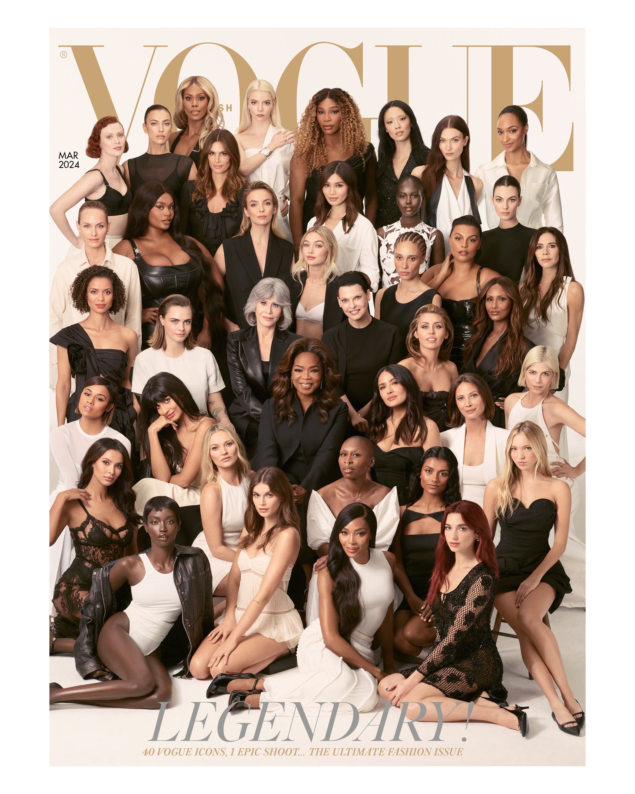 Image shows 40 women of varying ages and ethnicities gathered before a white studio backdrop. All are dressed in black, white or a combination of the two, and are looking into the camera. The four women at the front are sitting on the floor, and the rest are behind, arranged in rows that increase in height, so that all 40 are visible. Above their heads, the Vogue logo in gold letters. The cover line reads: “Legendary! 40 Vogue icons, one epic shoot... the ultimate fashion issue.”