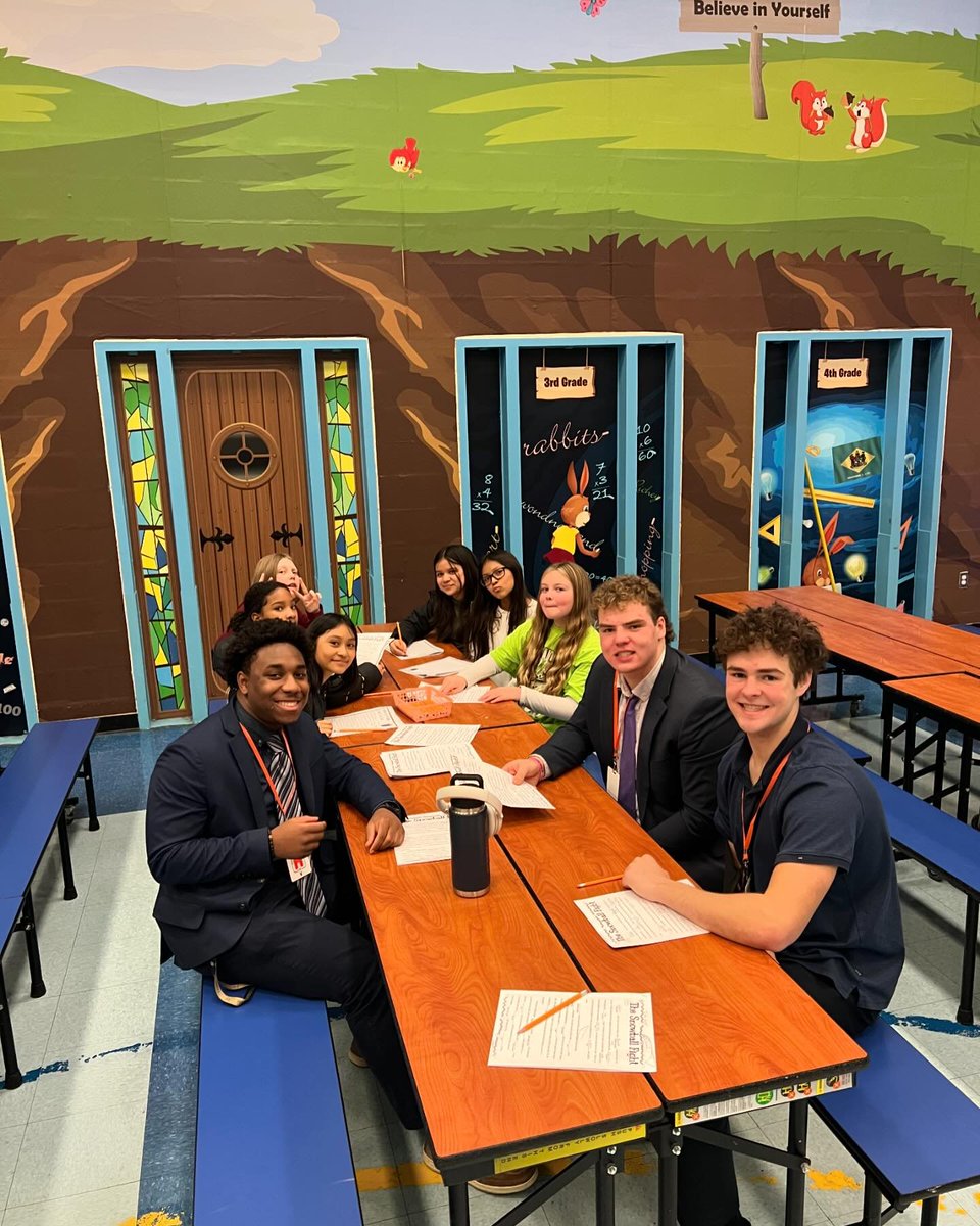 Salesianum's tweet image. Our football team recently took time to enjoy a day of reading, games, and storytelling with students at Richey Elementary School. #makingconnections #givingback #learningisfun
