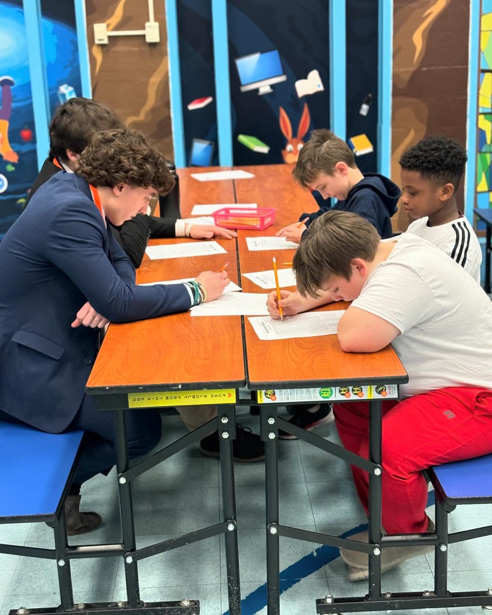 Salesianum's tweet image. Our football team recently took time to enjoy a day of reading, games, and storytelling with students at Richey Elementary School. #makingconnections #givingback #learningisfun