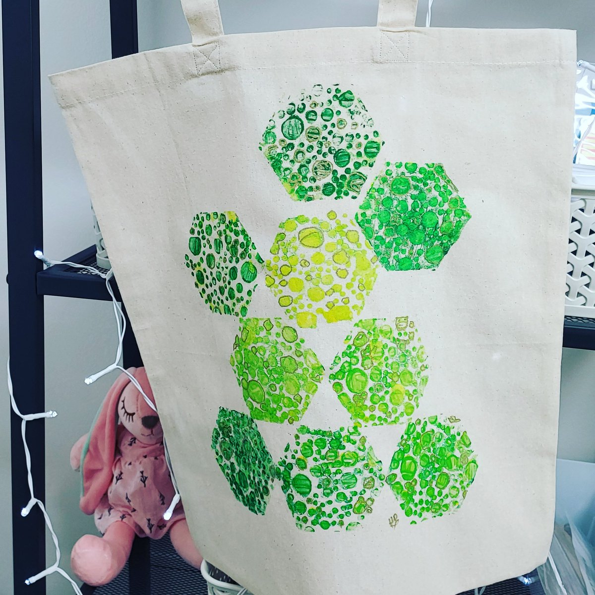 New tote bag just made by One of my students I teach One To One art lessons in Watercolour, Pastel, Acrylic, Mixed Media. I am really a mixed media artist so some of my students enjoy the craft side as well This was made with a Hexigan Gelli plate, stamps, Gold pen.