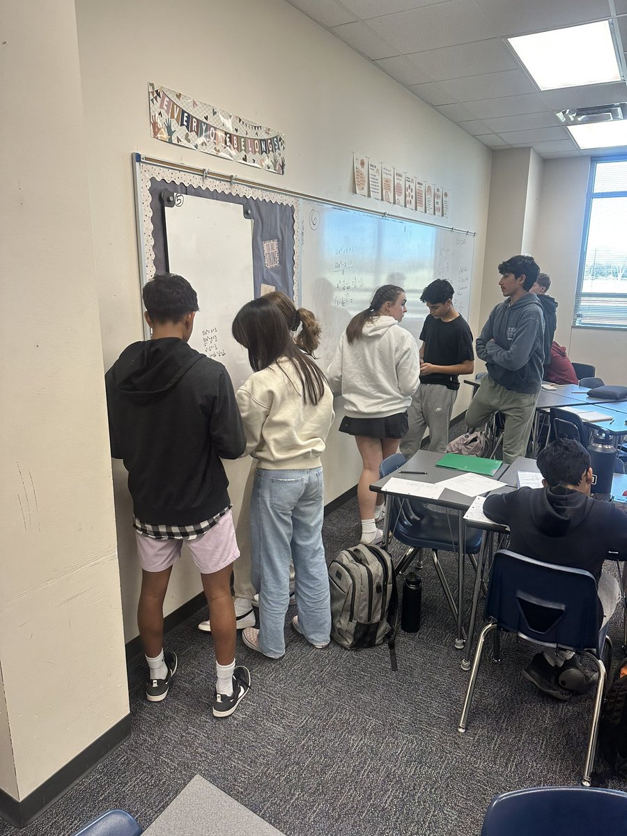Students working together today to piece together their knowledge of simplifying radicals, imaginary numbers, and solving equations to solve quadratic equations by completing the square.