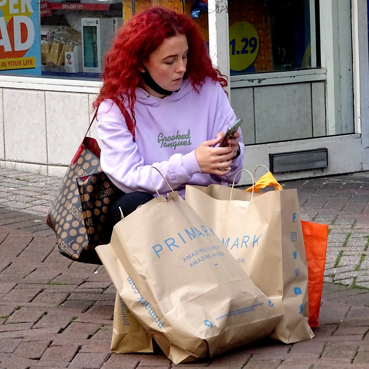 Shopping & Texting #streetphoto #streetphotography #photography #picture #pictures #ImageOfTheDay #image #images #street #streetscene #streets #people #colorphotography #woman #women #shopping #shoppingtime #phone #phones #SMS #sms #messaging #hustleandbustle