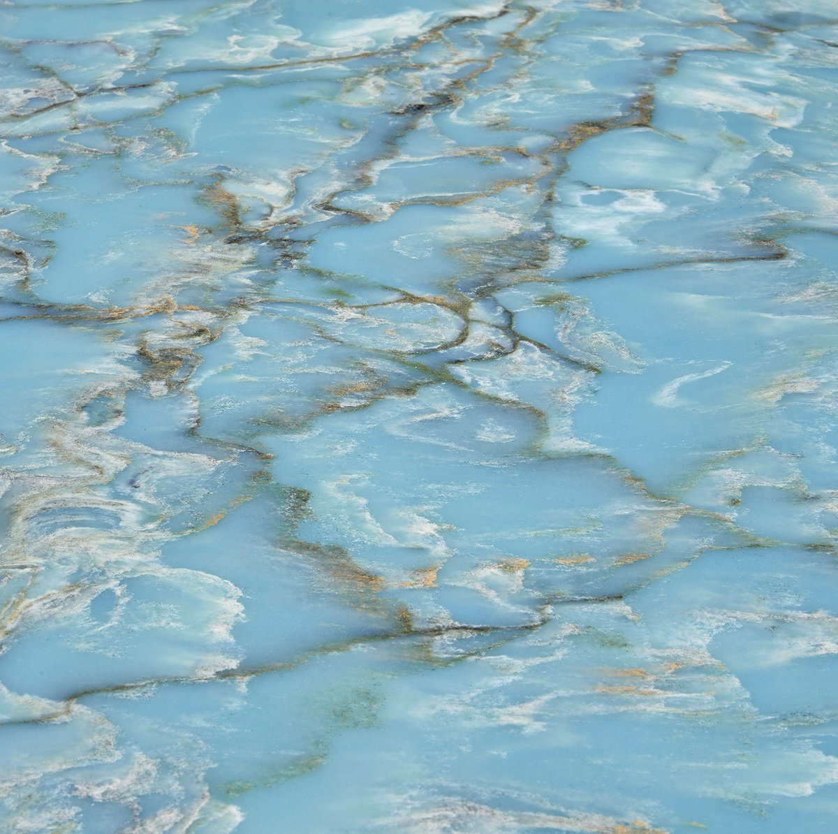 Cristallo Azure makes a stunning visual impression, while the durability of the quartz ensures it will stay looking beautiful with minimal maintenance. The striking sea-green colour makes it the perfect choice for this project where it contrasts with the nature-inspired décor.