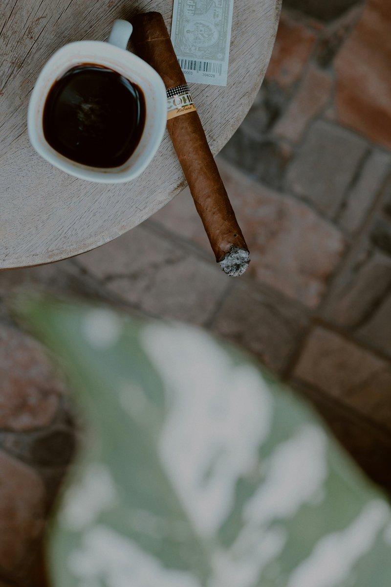 Embracing the cool morning breeze with every sip and puff. Coffee and cigars, a symphony of flavor and relaxation. #MorningMoments #CoffeeandCigars #TheDarlingHouse