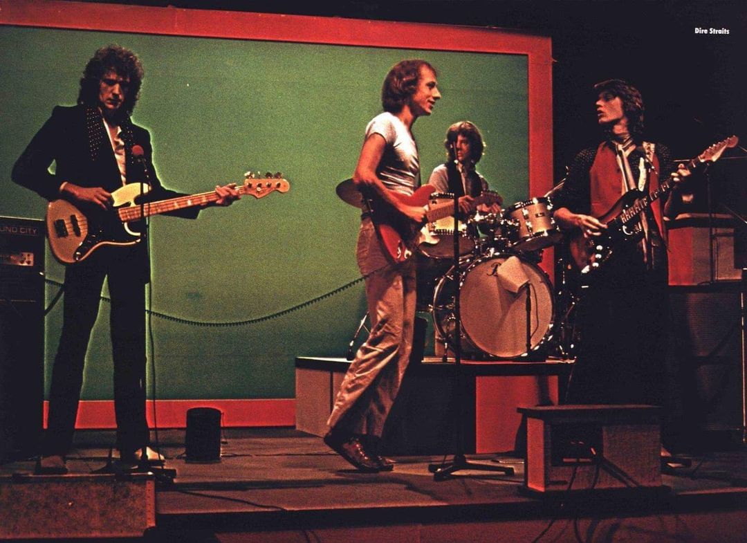 Dire Straits photographed circa 1979. This shot was included as a poster in an issue of POP, the Swiss music magazine.