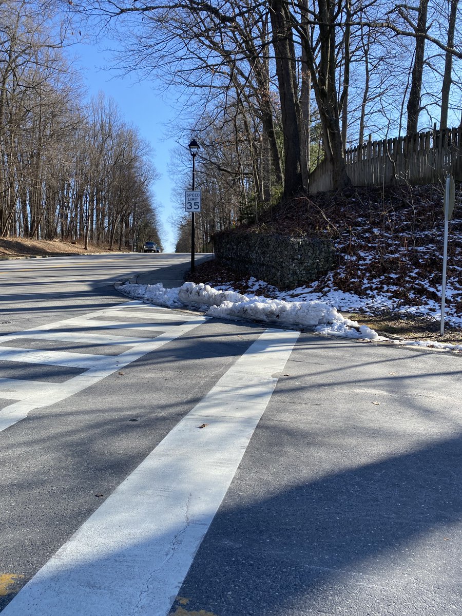 We watched a woman with baby in a stroller &amp;  a preschooler on a tricycle maneuver into Centennial Lane to get around this blockade of ice now 4 days after snowfall. Howard County needs to  avoid blocking school  paths when clearing snow. This is in the walk zone for  3  schools.