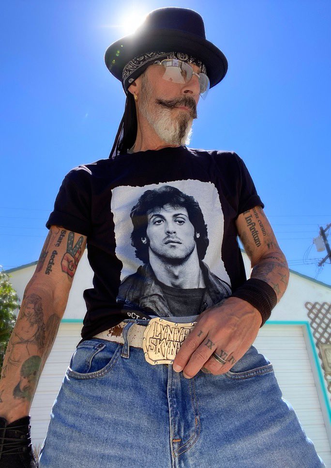 Check out the very talented photographer from Shades of Elvis @chrisameruoso in our mugshot tee! The Sly Stallone Shop is the only place in the world where you can get the officially licensed Rambo mugshot tee created by us in 2017 and launched in 2018! #SylvesterStallone #Rambo