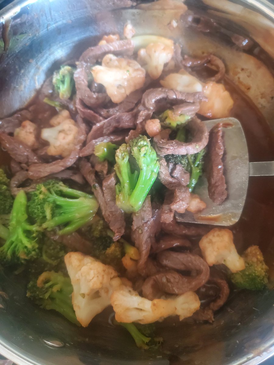 1 lb beef strips in 1 tbsp olive oil, 2 cups broccoli/cauliflower,  1/4 c hoisin sauce, 1/4 c Catalina dressing, 1 tbsp grated gingerroot - Serve over rice!  Ta da!  15 min meal.