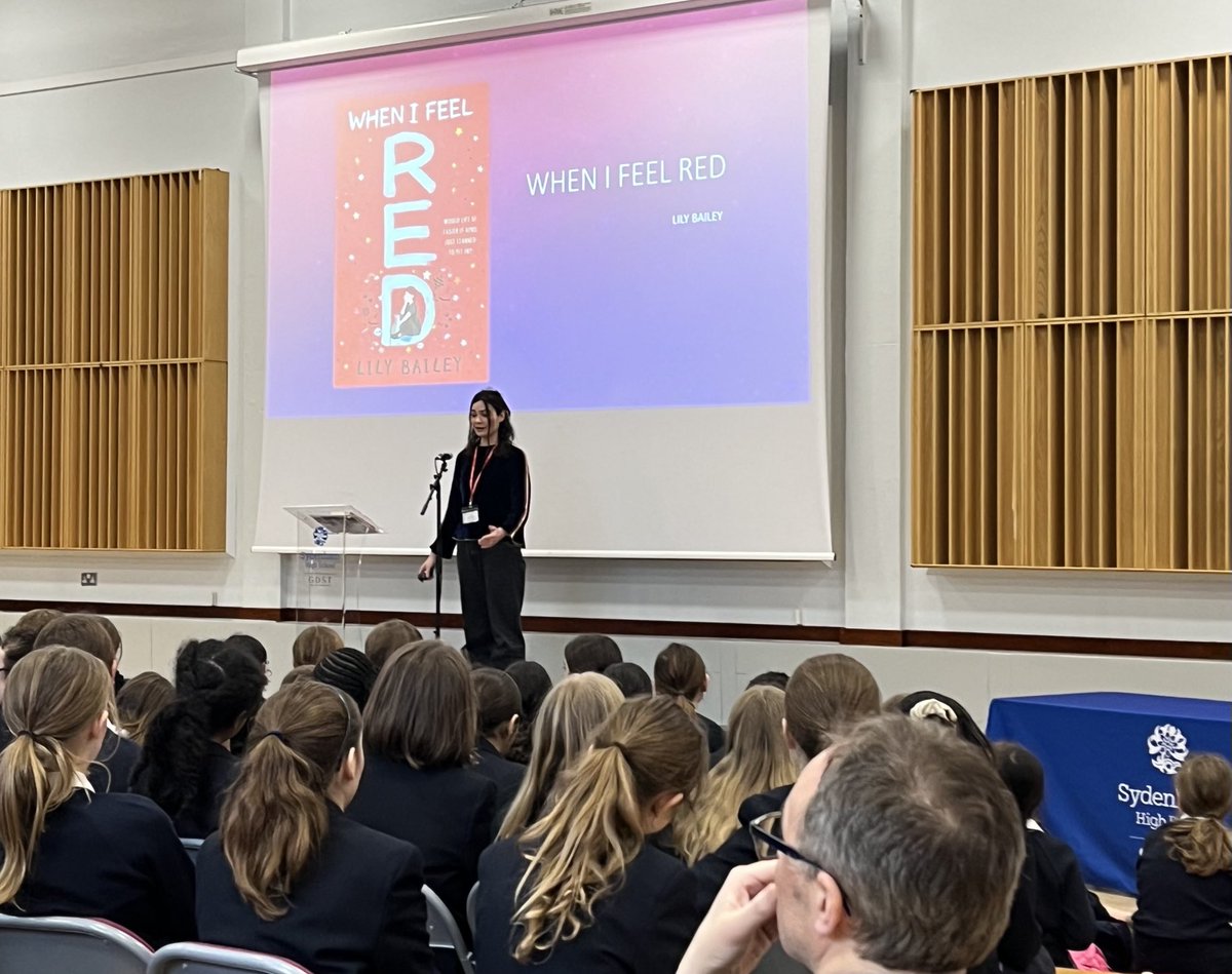 SydHighLibrary's tweet photo. A huge thank you to @LilyBaileyUK for such an engaging talk to our years 6, 7 & 8 students today. Lots of book sold by @KirkdaleBooks & even some visiting students from other @LewishamLibs schools. #WhenIFeelRed😊@SydenhamHigh https://t.co/ycFaQI6w54