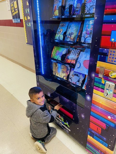 TaraJacob5's tweet photo. To recognize Laney and Sawyer's reading accomplishments, each was awarded a trip to FNE's book vending machine. These fabulous kindergarten students have each read 100 books! Mrs. Fleming and FISD congratulate you on your accomplishments. https://t.co/qhC49X92KB