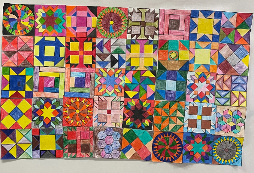 Quilts were more than just blankets for warmth; they were maps to freedom during the Underground Railroad. Stitched with secret codes and symbols, they guided enslaved people to safety. Each stitch told a story of bravery and hope. Created by Lo Presti's 5/6s and Leblanc 6s.