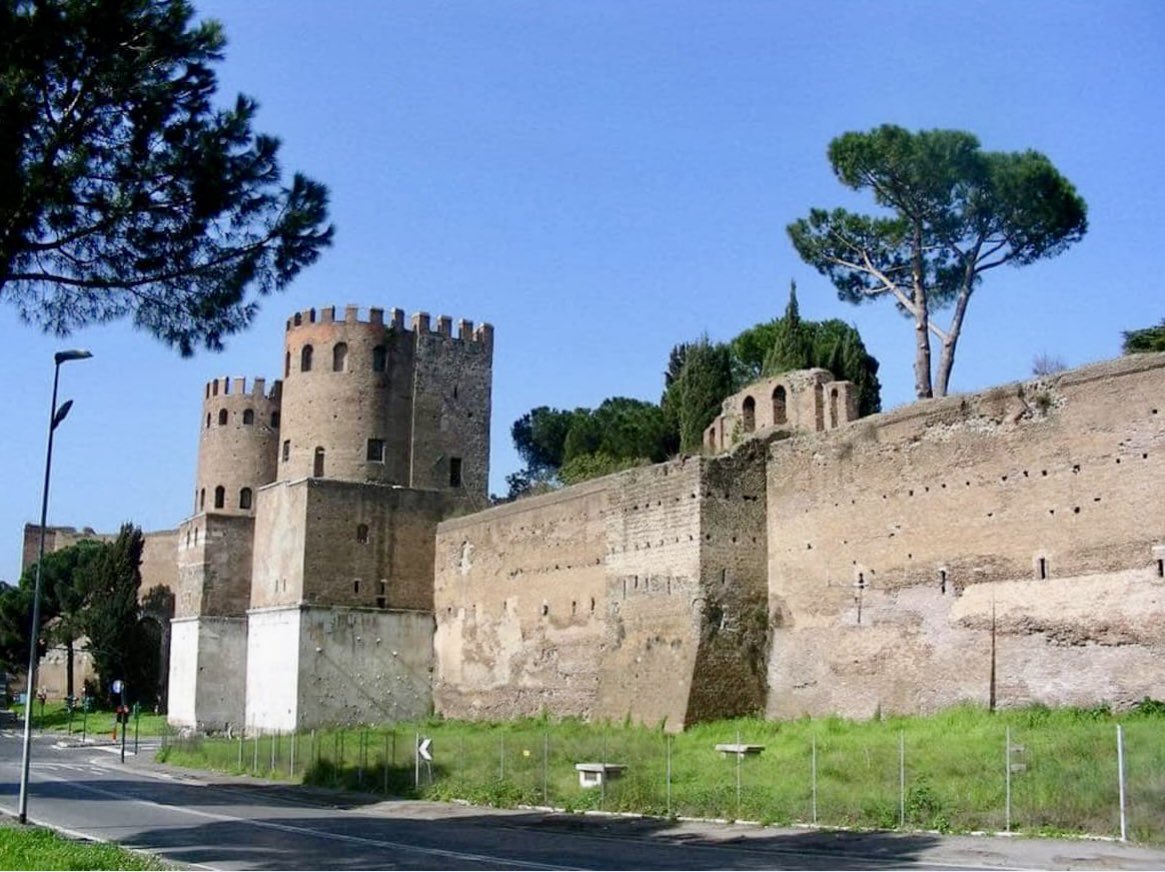 romaurbsaeterna's tweet photo. The Aurelian Walls, raised from AD 271-275, encircled Rome with a formidable 19 km (12 mi) barricade, enhancing and improving the older and smaller 4th century BC Servian defenses. These walls, constructed in brick-faced concrete, towered at 8 m (26 ft) and later doubled in height, defending an area of 13.7 km2 (5.3 sq mi). It was a monumental effort by Rome  to protect the city, integrating existing structures for rapid completion. The walls stood as a bulwark, their 383 towers and 18 gates a symbol of Rome’s power resilience. #AncientRome 📷: Mario Aramburri, 2017