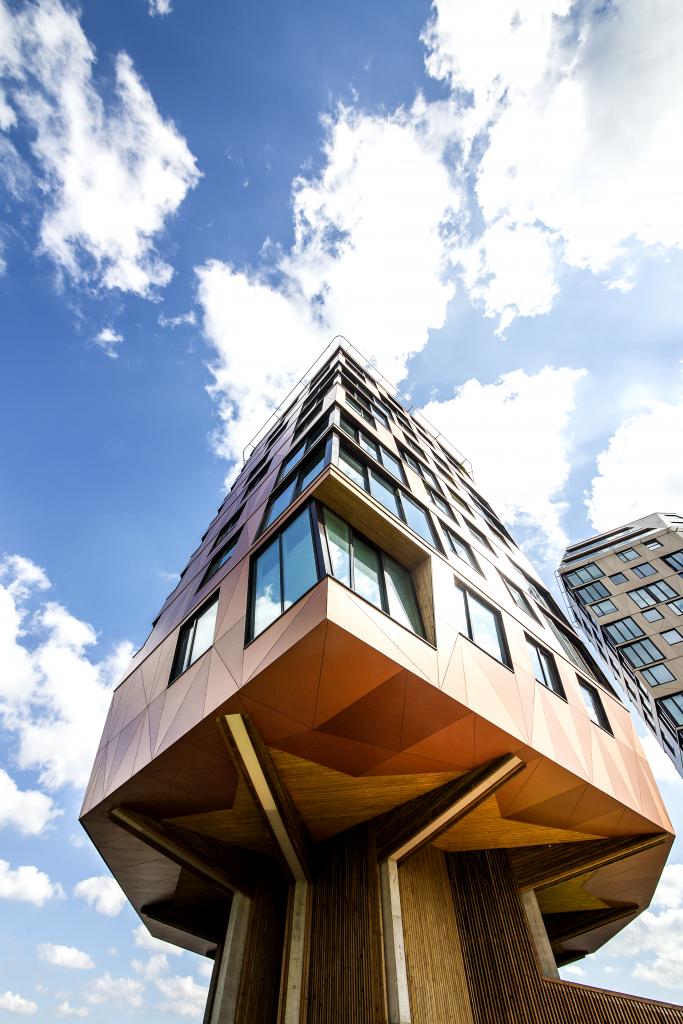 In Sandnes, Norway, Rundeskogen Twoters rise, a testament to innovative design by Helen &amp; Hard and dRMM Architects. Clad in Trespa® Meteon® Metallics, these towers offer stunning fjord views while enhancing community life with vibrant public spaces.