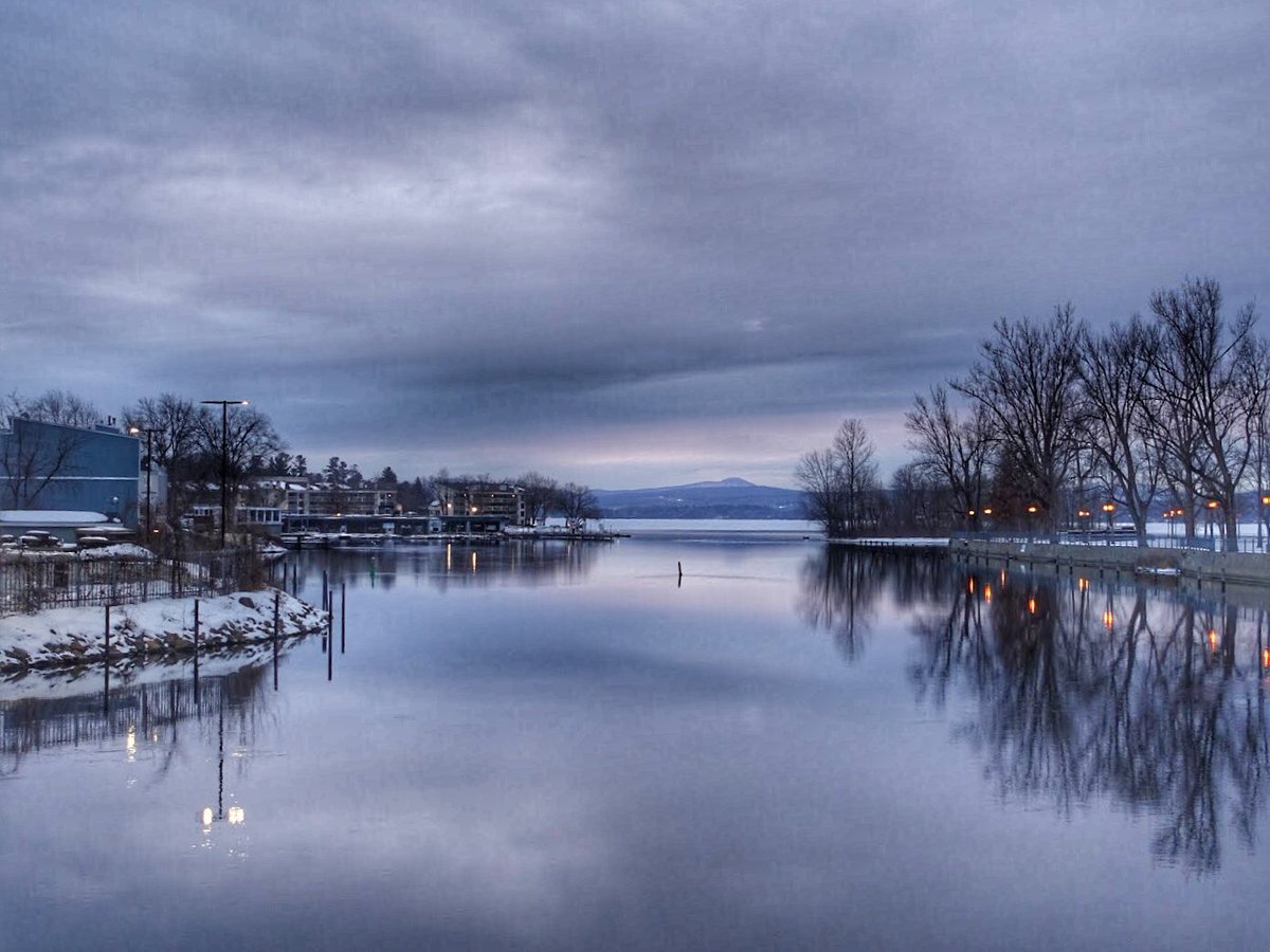 Picturesque Lake Memphremagog in downtown Magog is bordered by a lovely more-than-a-mile ice skating path. #Quebec #EasternTownships #travel