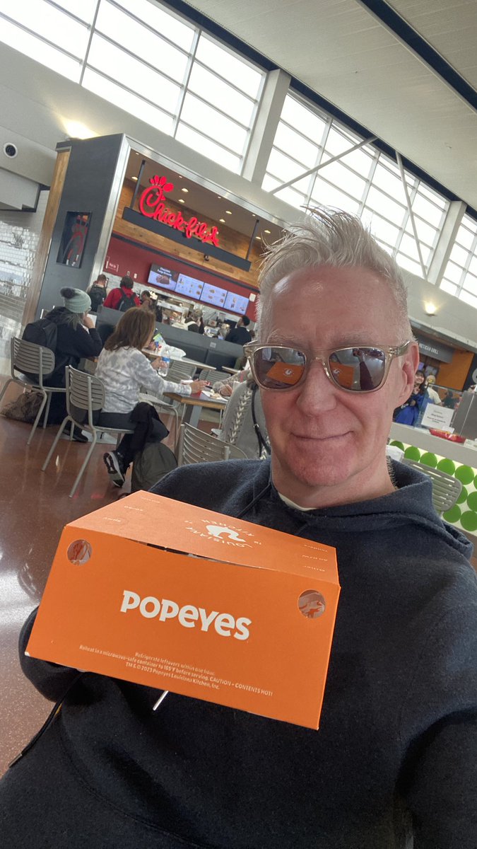 Enjoying my homophobia-free <a href="/Popeyes/">Popeyes</a>  chicken in the food court at Detroit Metro. ✈️🍗🌈