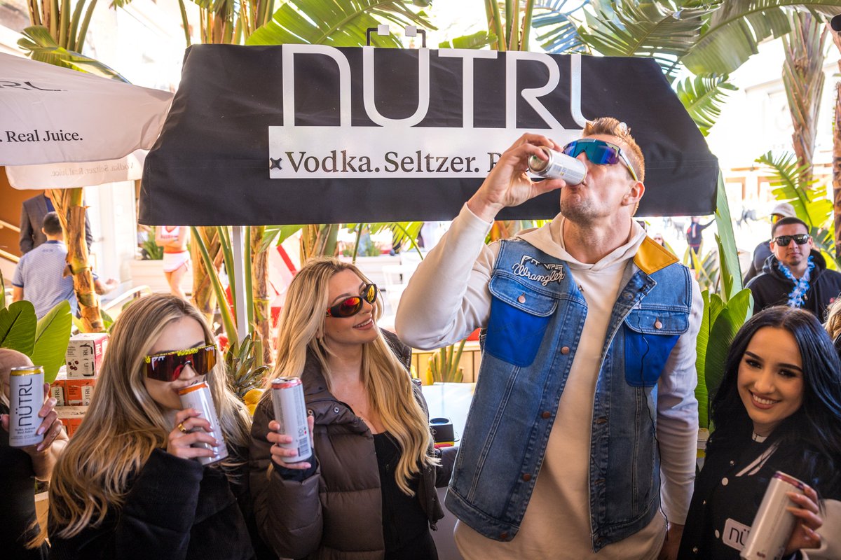 Who needs a getaway when you have #GronkBeach and @nutrl_usa Vodka Seltzer? 🍍☀️ The perfect blend of sun, DJs, and the most delicious canned cocktail made for an epic Big Game Weekend day party! #Keepittasty