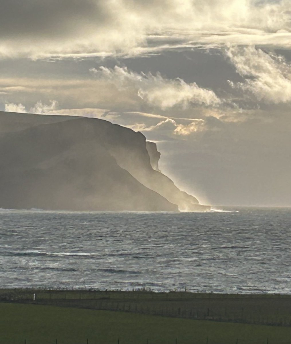 Spray from the Atlantic swell is backlit by the sun as it is forced up the 1200 feet high cliffs of St. John’s Head on Hoy by today’s strong westerly wind.  #Orkney