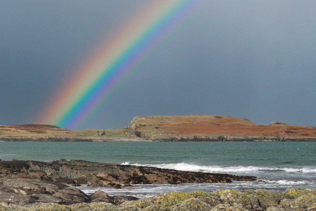 Part of an incredible rainbow over the ruined chapel on Nave Island today. #Islay