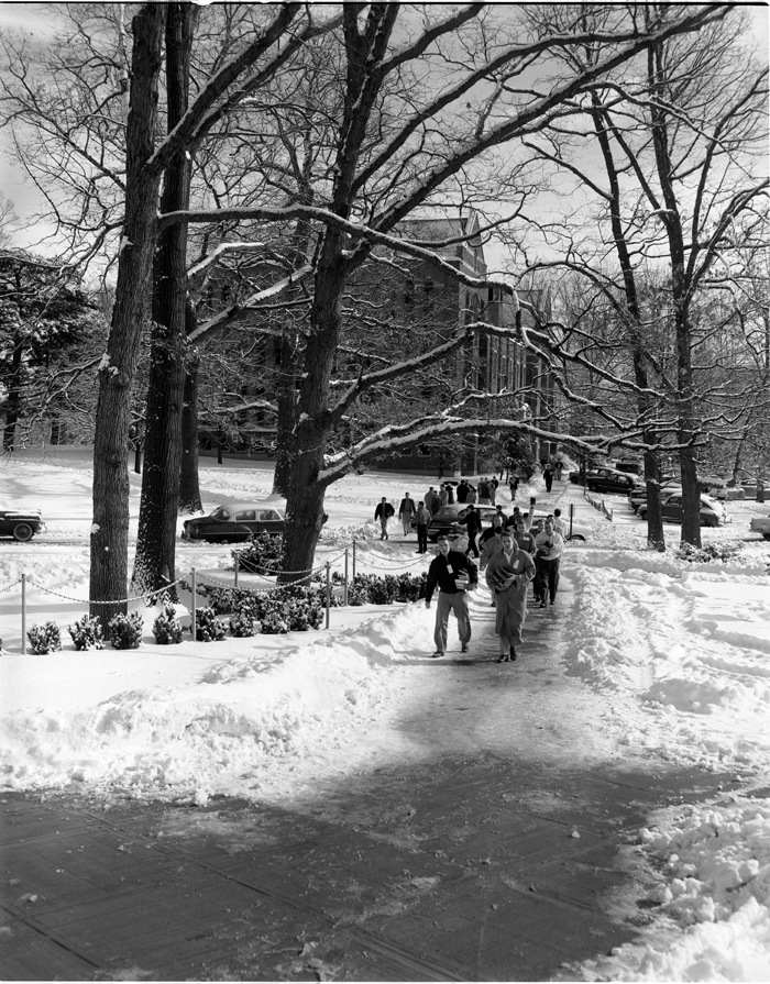 #TBT Photograph of students carrying books from the old library to the new library building on February 20, 1956. #MSUHistory