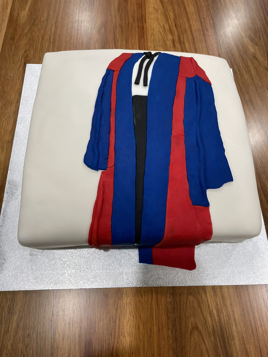 What a beautiful cake to celebrate being promoted to Distinguished Professor, thanks to <a href="/BruceWarrington/">Bruce Warrington</a>. It shows my wonderful DPhil gown. Thank you to everyone who has supported my academic journey!